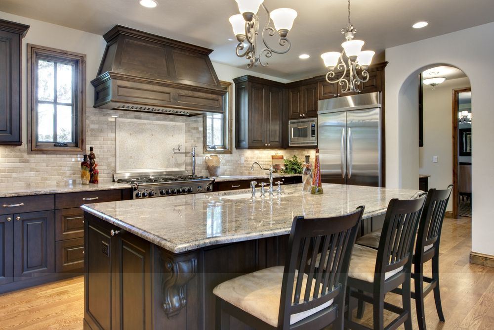 A kitchen with stainless steel appliances and granite counter tops