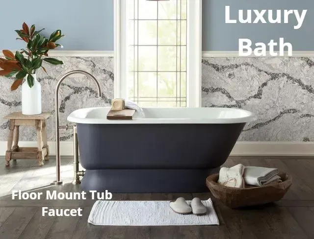 Luxury bathroom with black freestanding tub, floor-mount faucet, and marble accents