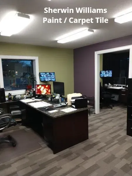 Sherwin Williams Paint/Carpet Tile office with desks, computers, and a showroom-style workspace