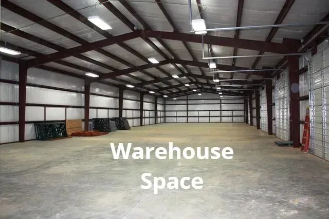 Empty warehouse interior with concrete floor and metal beams, labeled “Warehouse Space”