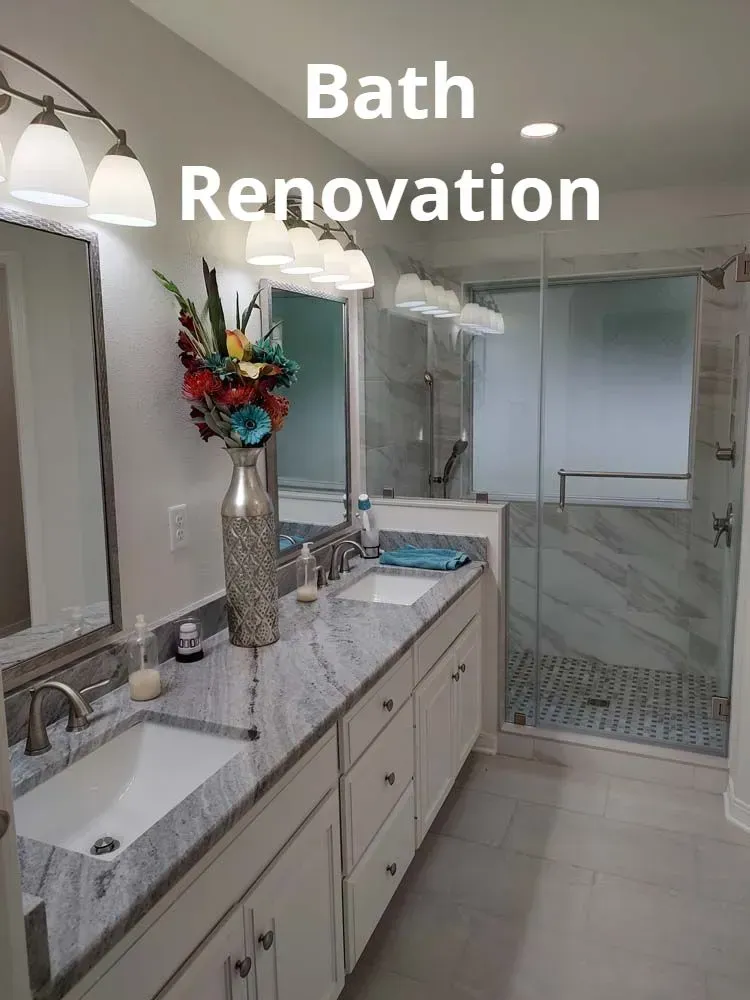 Modern bathroom renovation with double vanity, marble counters, and glass shower door