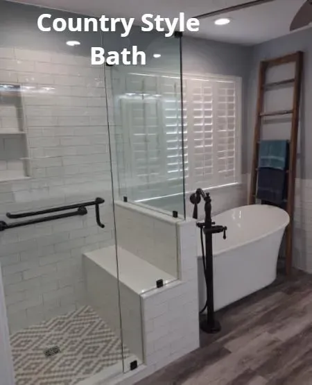 Country-style bathroom with glass shower, freestanding tub, white shutters, and wood-look floor