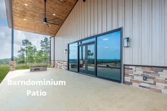 Covered patio with wood ceiling, large glass doors, and stone-accented exterior wall