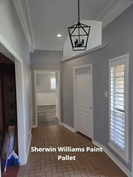 Hallway with gray walls, white trim, pendant light, and overlay text “Sherwin Williams Paint Pallet”