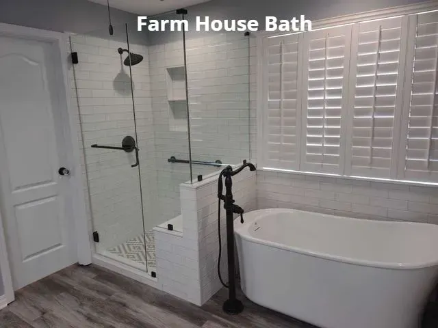 Modern farmhouse bathroom with freestanding tub, glass shower, white shiplap, and plantation shutters