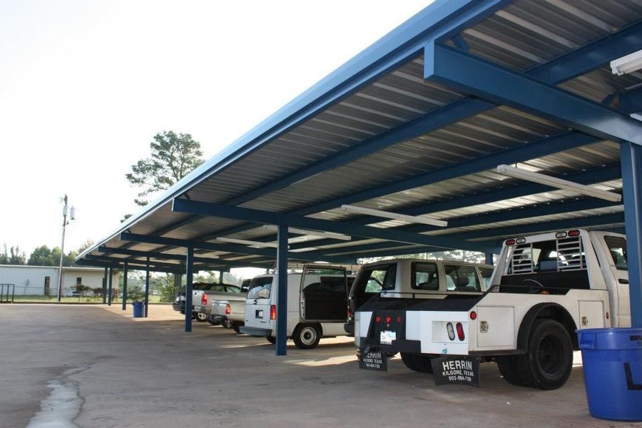 A man is loading boxes into the back of a van.