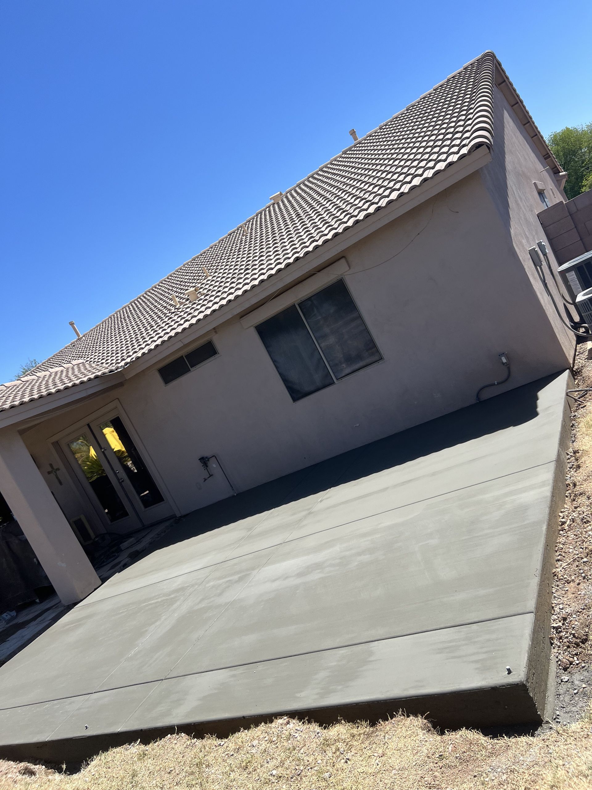NORC Concrete LLC crew finishing a driveway pour in Phoenix, AZ