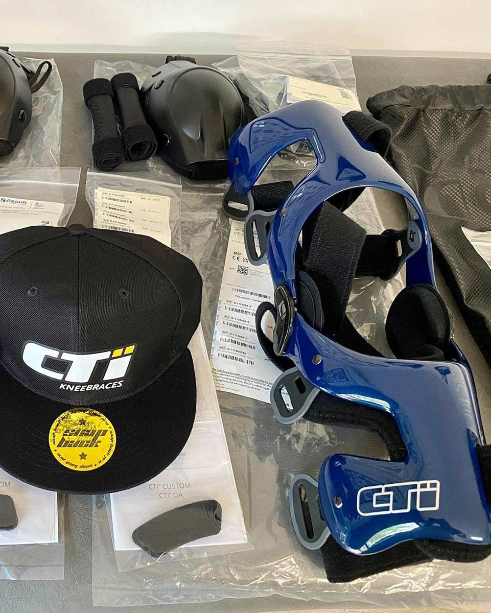 A Black Hat and a Blue Helmet Are on a Table — Gall Bros Medical in Robina, QLD