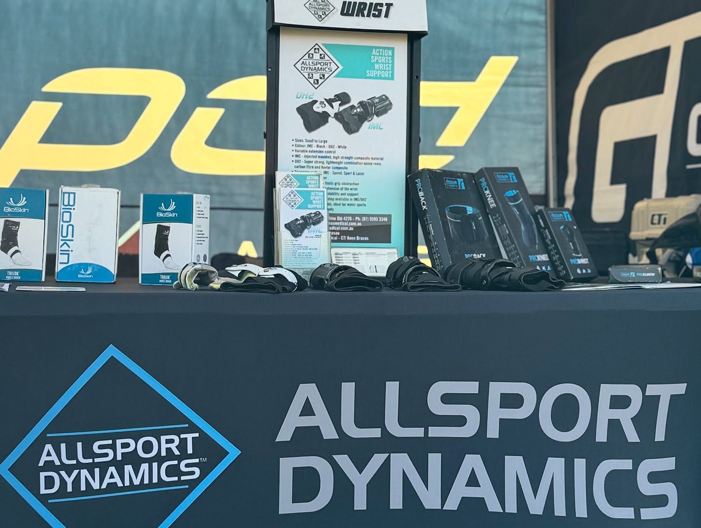 A Table With a Sign That Says AllSport Dynamics — Gall Bros Medical in Rockhampton, QLD