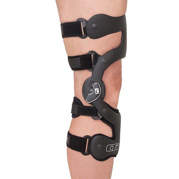 Leg Brace With Black Straps and Metal Hinges on a Person’s Lower Leg — Gall Bros Medical in Robina, QLD