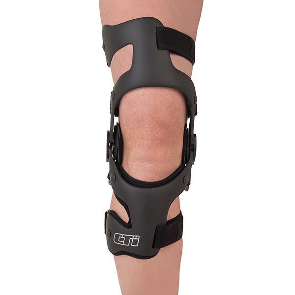 Black Knee Brace With Straps and Metal Hinges on a Bent Leg — Gall Bros Medical in Robina, QLD