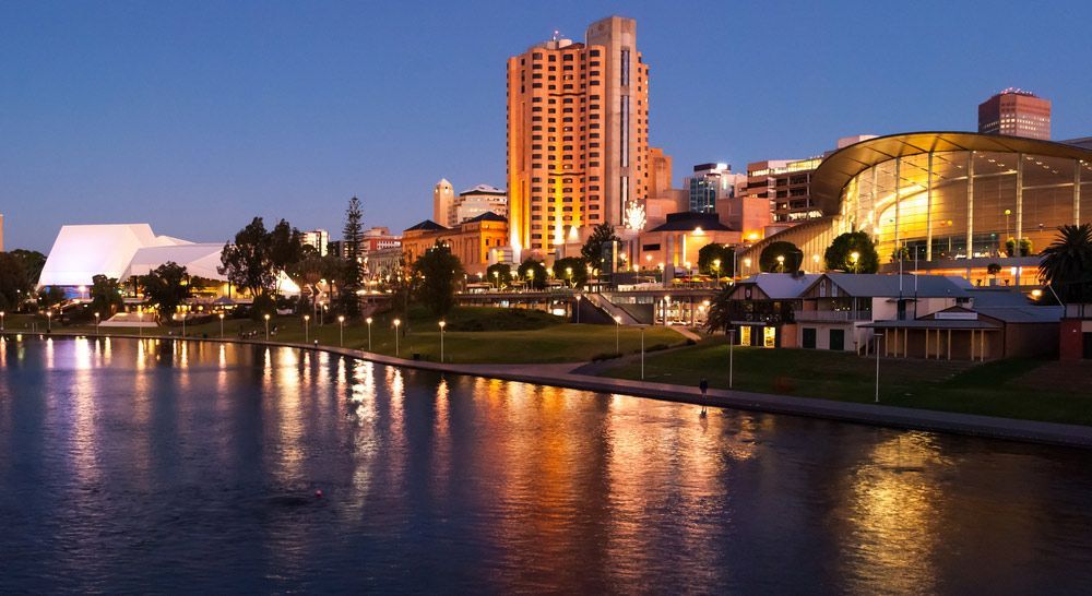 A City at Night With a Large Body of Water in the Foreground — Gall Bros Medical in Adelaide, SA