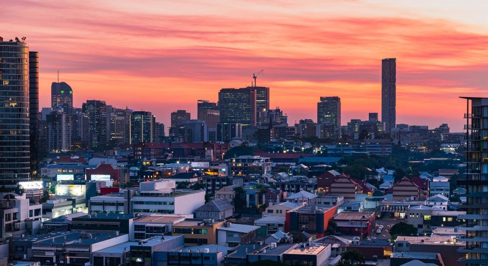 An Aerial View of a City Skyline at Sunset — Gall Bros Medical in Brisbane, QLD