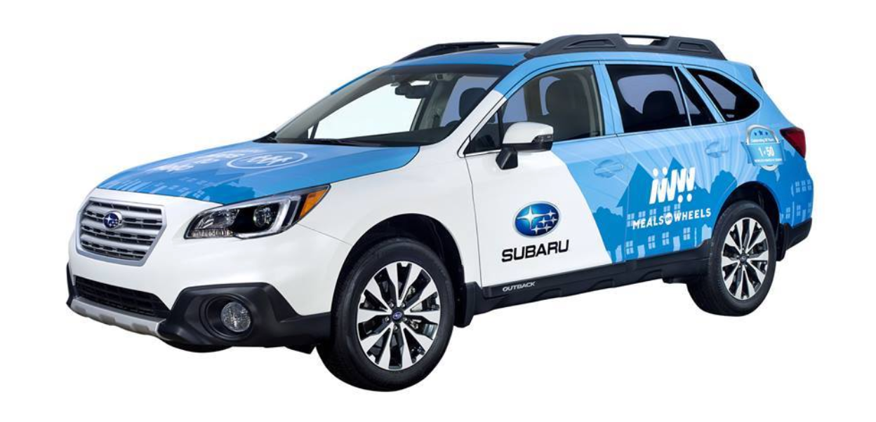 Blue and white Subaru SUV with company graphics, shown in profile on a white background