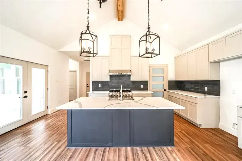 There is a large island in the middle of the kitchen.