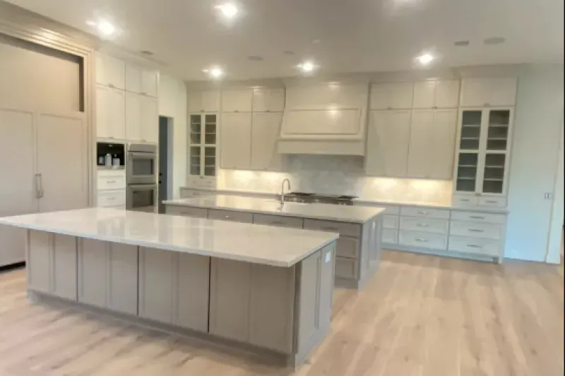 There is a large island in the middle of the kitchen.