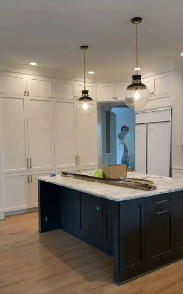 There is a large island in the middle of the kitchen.