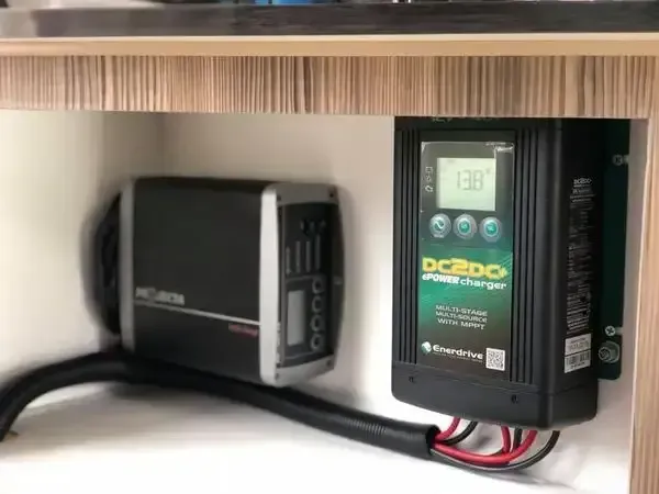 A Solar Panel Charger Is Sitting Under A Wooden Table — REM Auto Electrics In Lake Macquarie, NSW