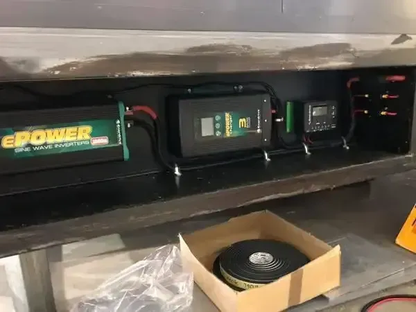 A Box Of Tape Is Sitting On A Table Next To A Box Of Batteries — REM Auto Electrics In Newcastle, NSW