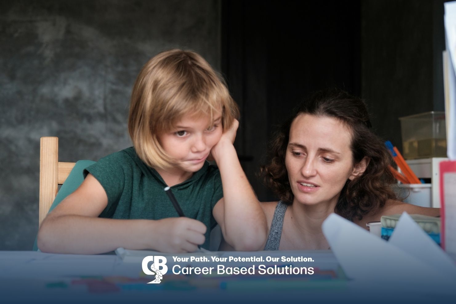 Therapist assisting autistic kid with schoolwork at a desk, highlighting support strategies