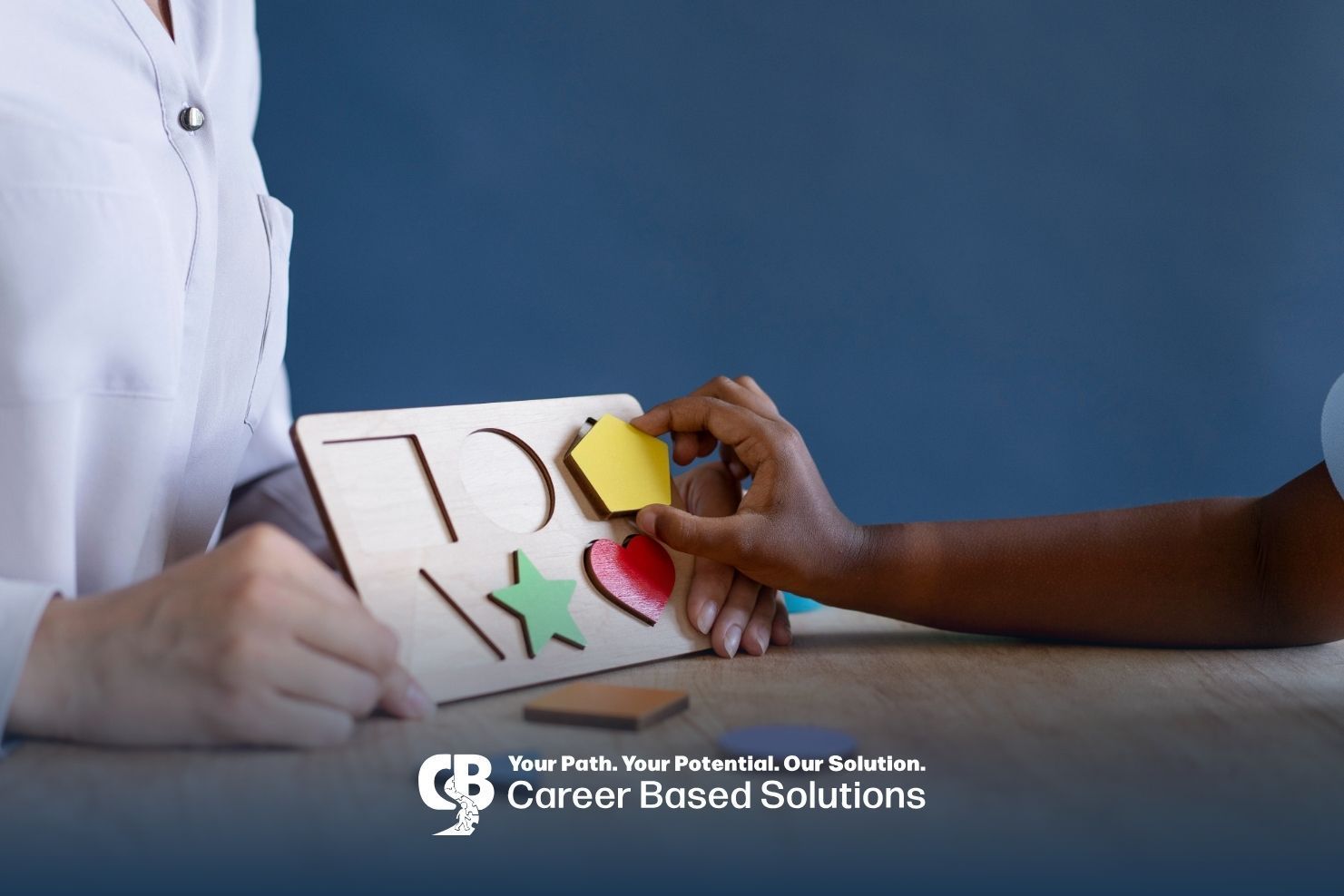 Child participating in a therapy activity with a professional using colorful shapes to encourage lea
