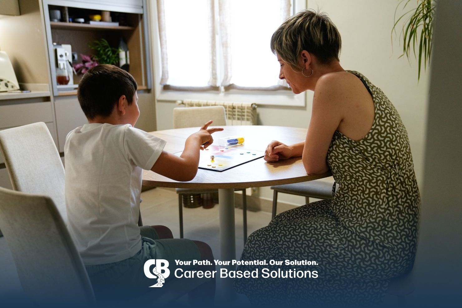Autistic kid working with a caregiver during ABA while practicing skills with prompts & activities.