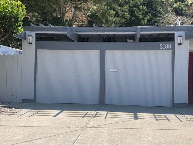 Two-car gray garage with a modern facade and house number 2188