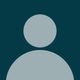 Generic user avatar icon with light gray silhouette on dark teal background