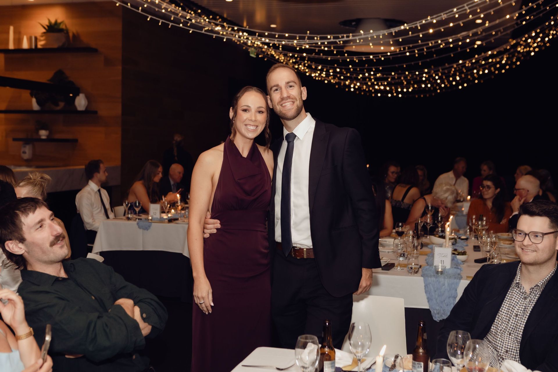 Couple standing among the tables at the EverLend International Women's Day Charity Gala