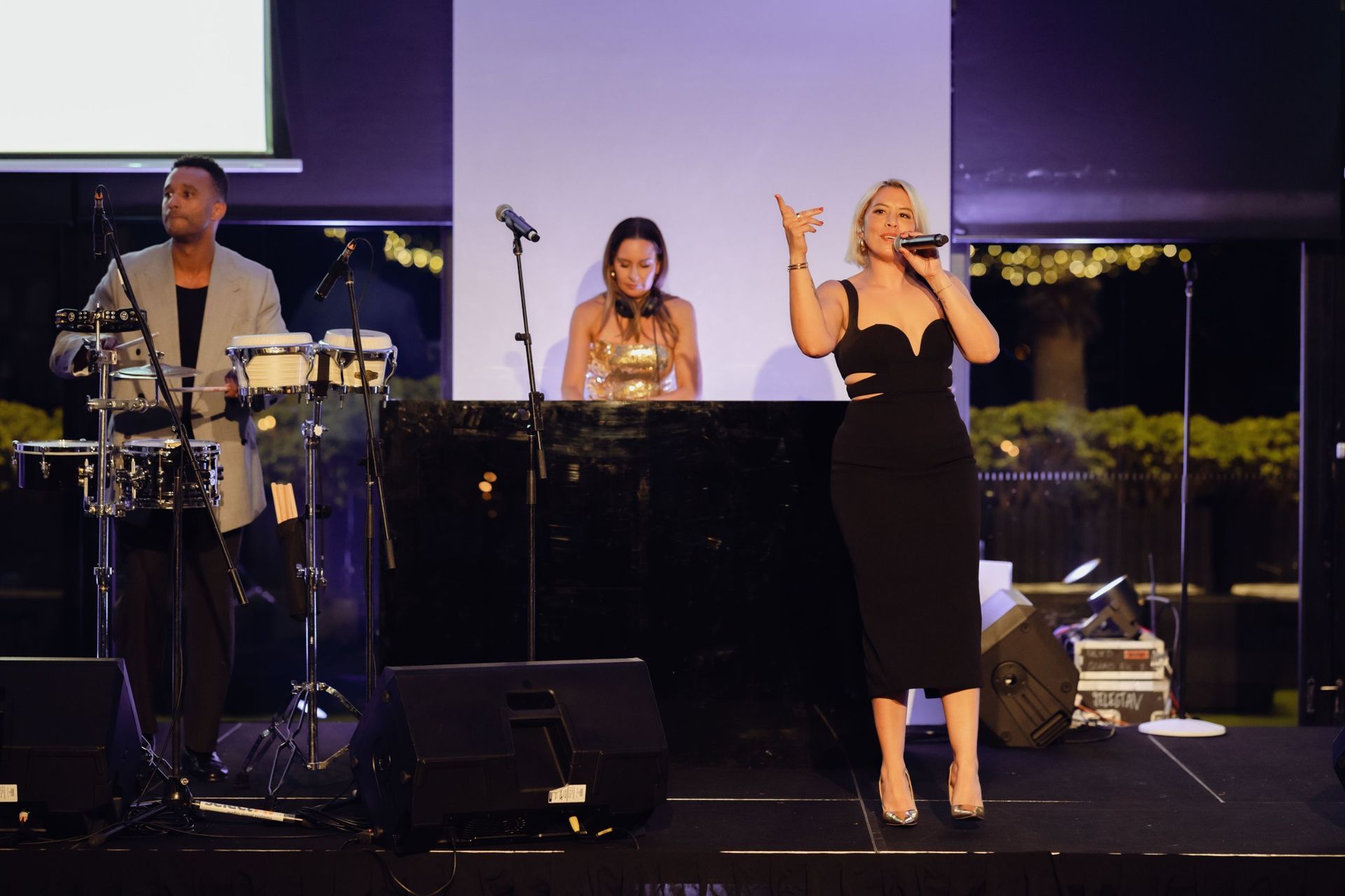 Live band with singer, DJ and percussionist performing at the EverLend International Women's Day Charity Gala