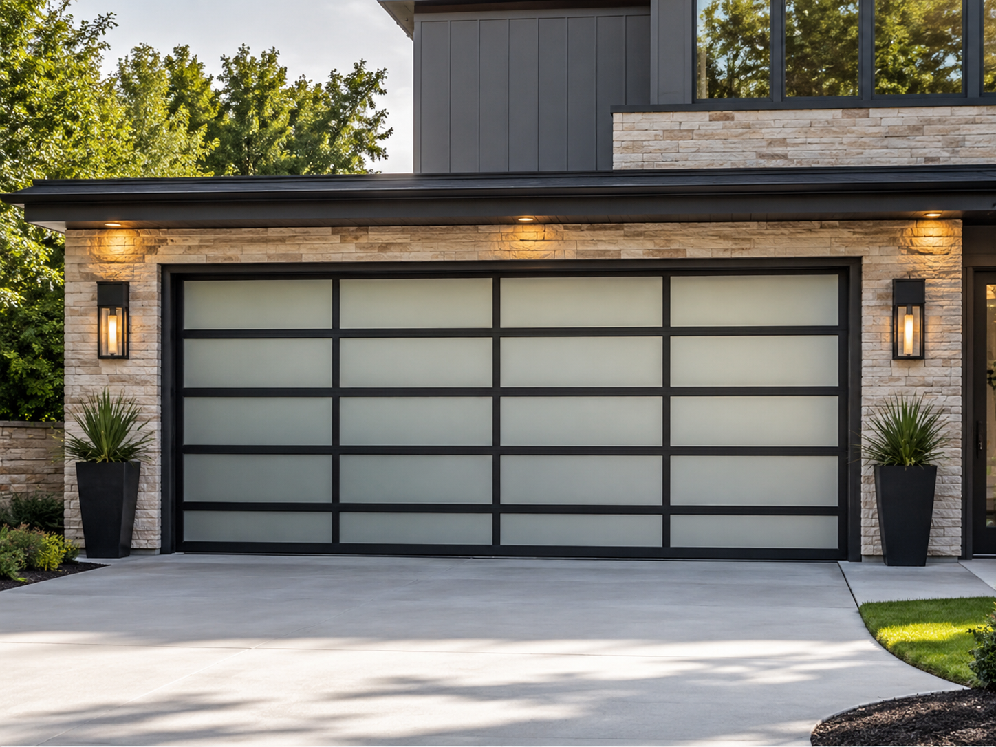 Modern two-car garage with frosted glass doors and stone facade in a contemporary home exterior