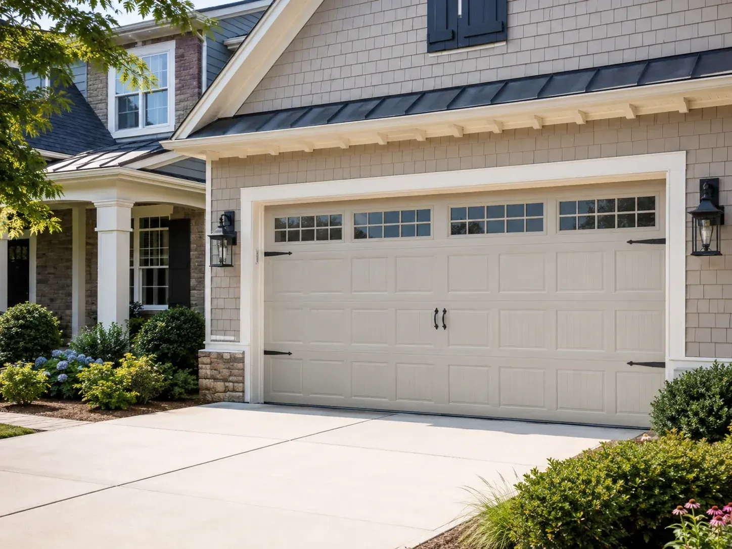 Custom vinyl garage door with top window panels on a residential home