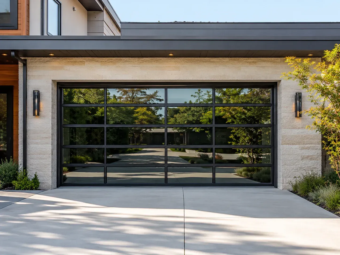 Full-view aluminum glass garage door on a modern residential home
