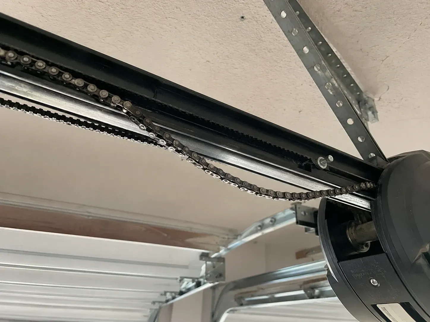 Garage door opener chain repair for a residential overhead garage door in Roscoe IL