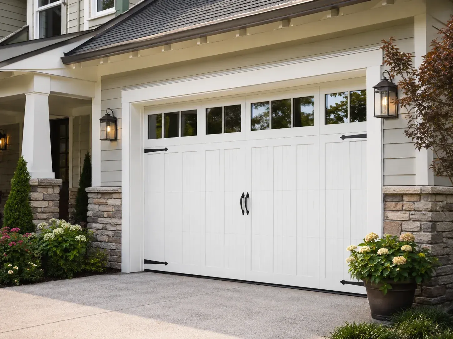 Insulated carriage house garage door with windows on a residential home