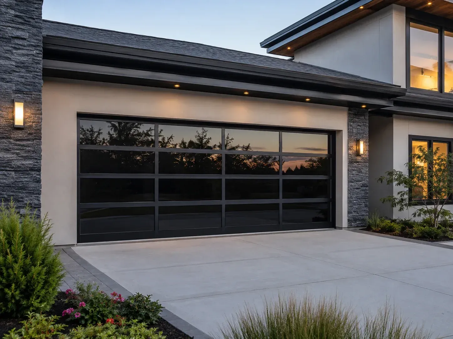 Tinted glass aluminum garage door on a modern residential exterior