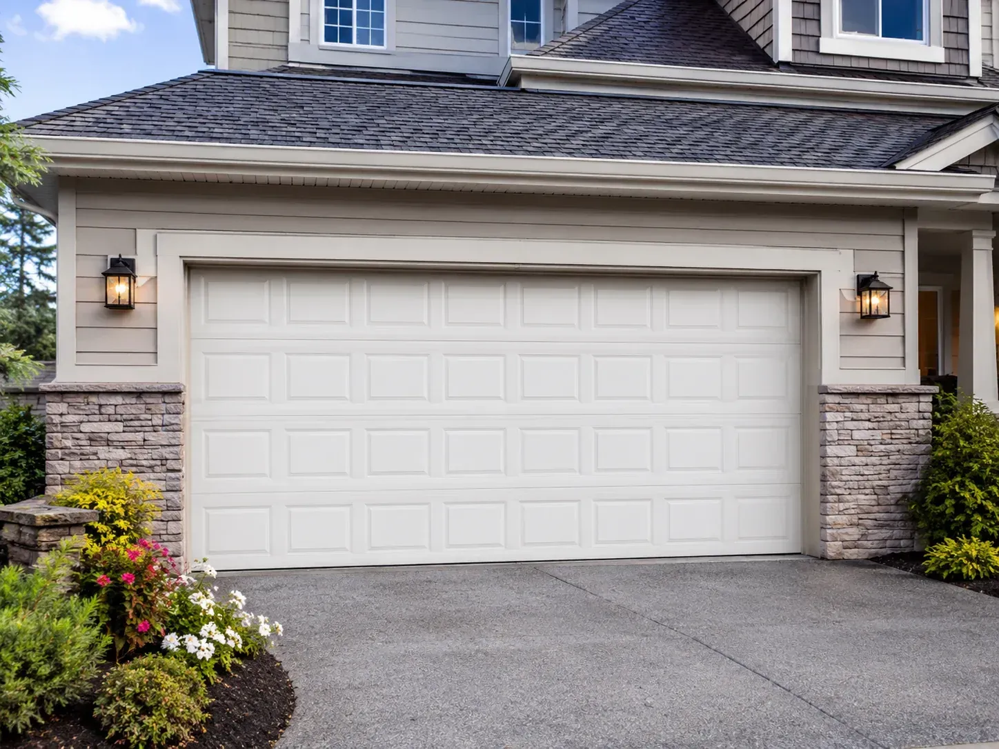 Traditional white insulated garage door with classic raised panels