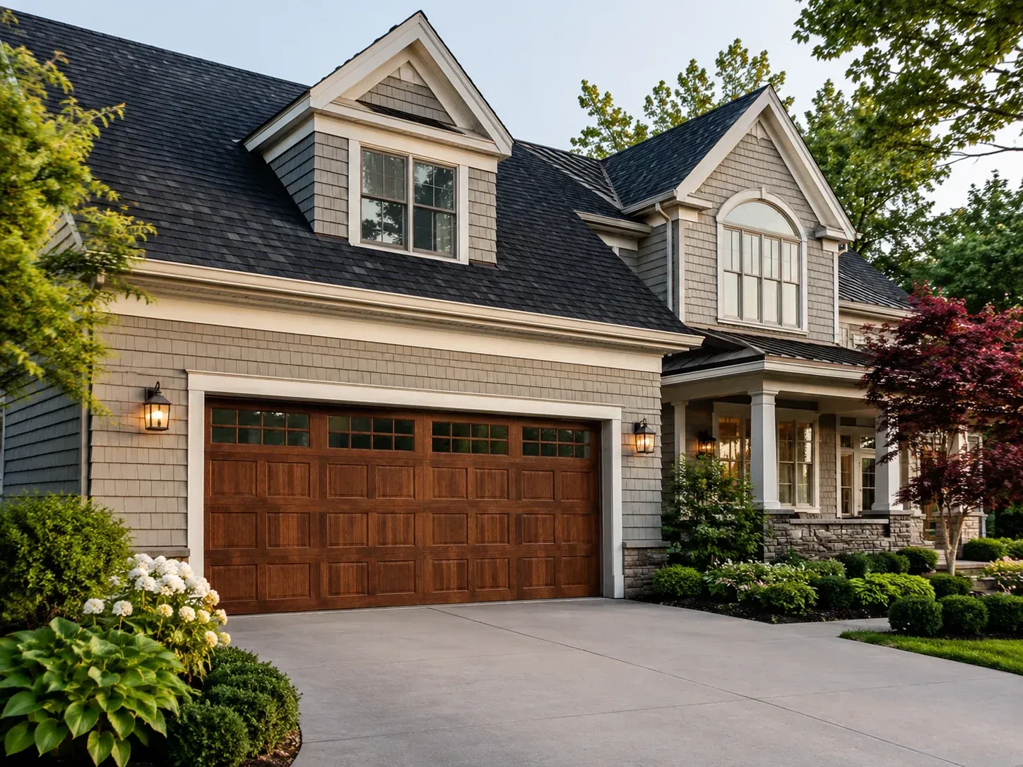 Traditional wood garage door with top window panels on a residential home