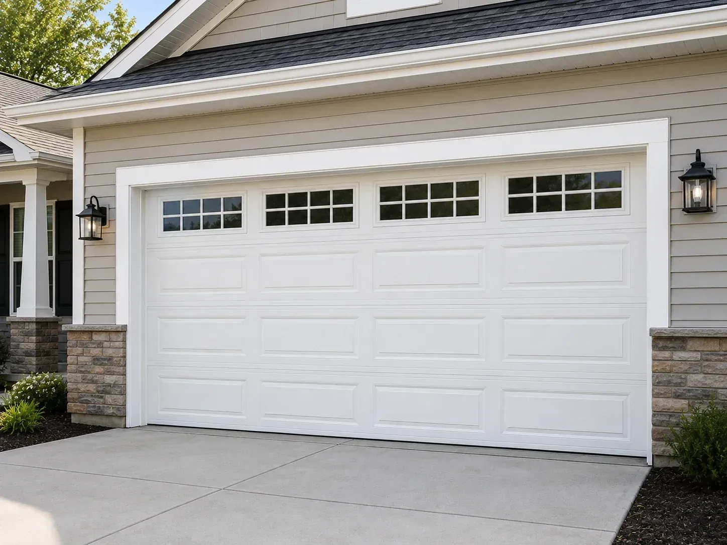 White garage door with top windows used as a comparison for aluminum garage door styles