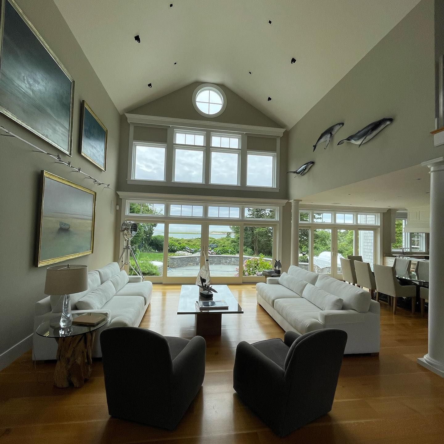 Spacious living room with large clean windows overlooking the ocean | Residential window cleaning Cape Cod
