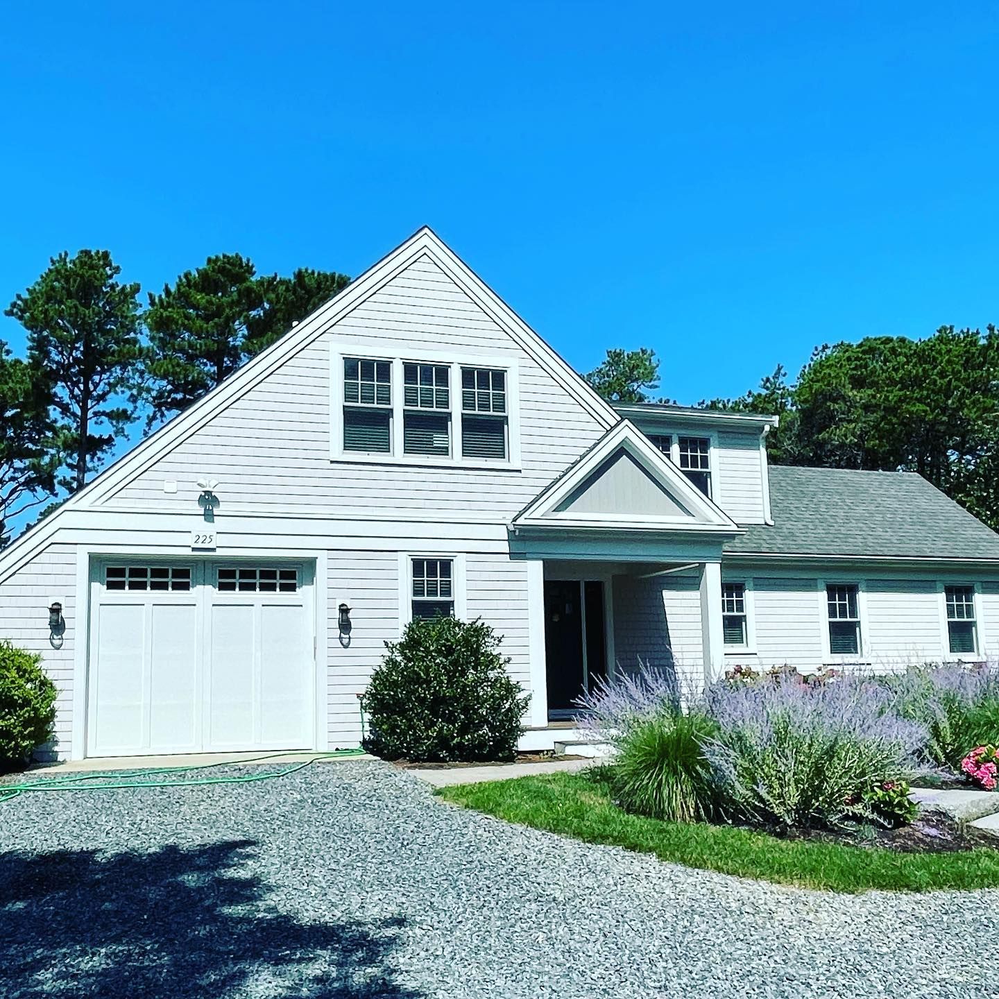Clean residential windows on modern white house | Residential window cleaner Cape Cod