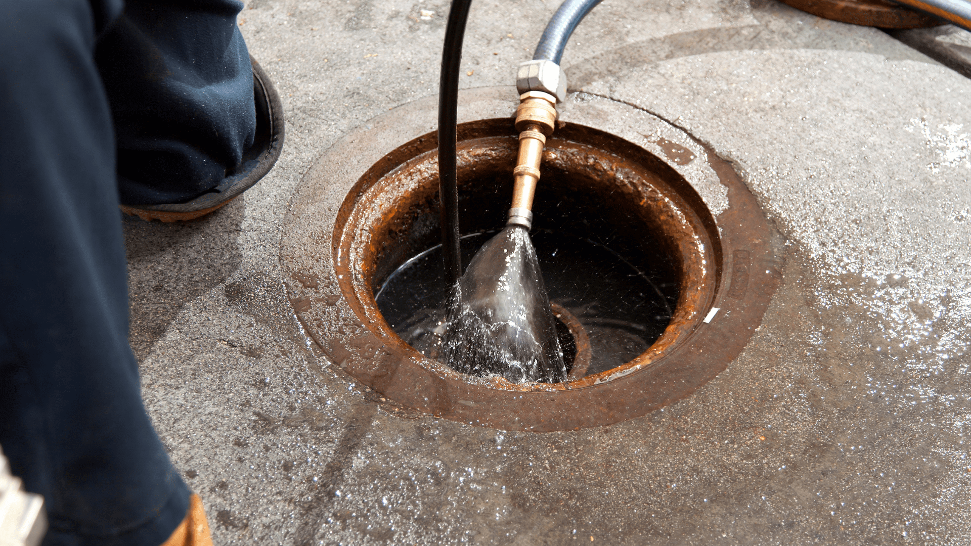hydro jetting services offered in North GA where pipes are cleaned out with pressure. Image of water pressure in sewer pipe