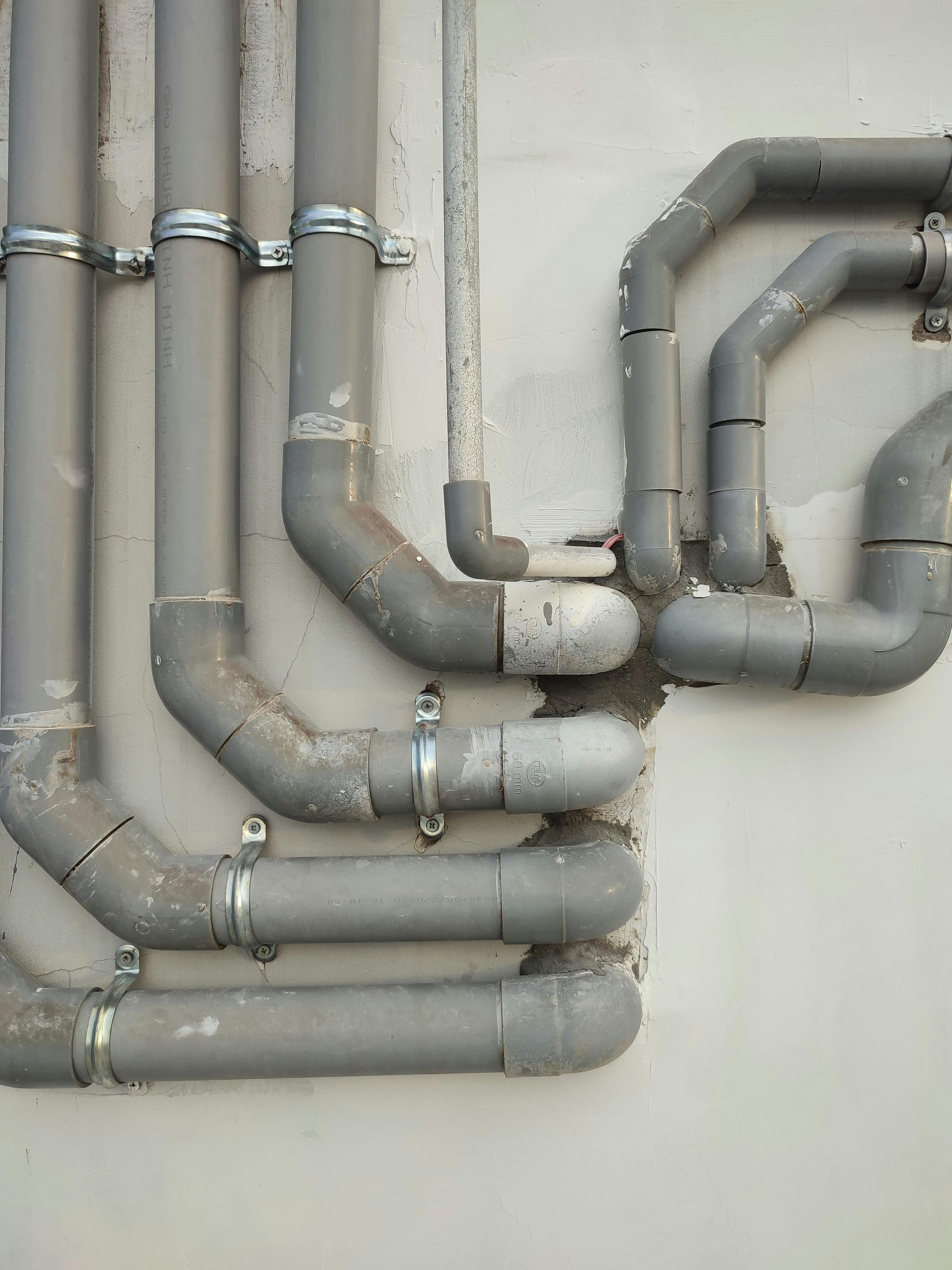 plumbing services with grey outdoor piping for a commercial property