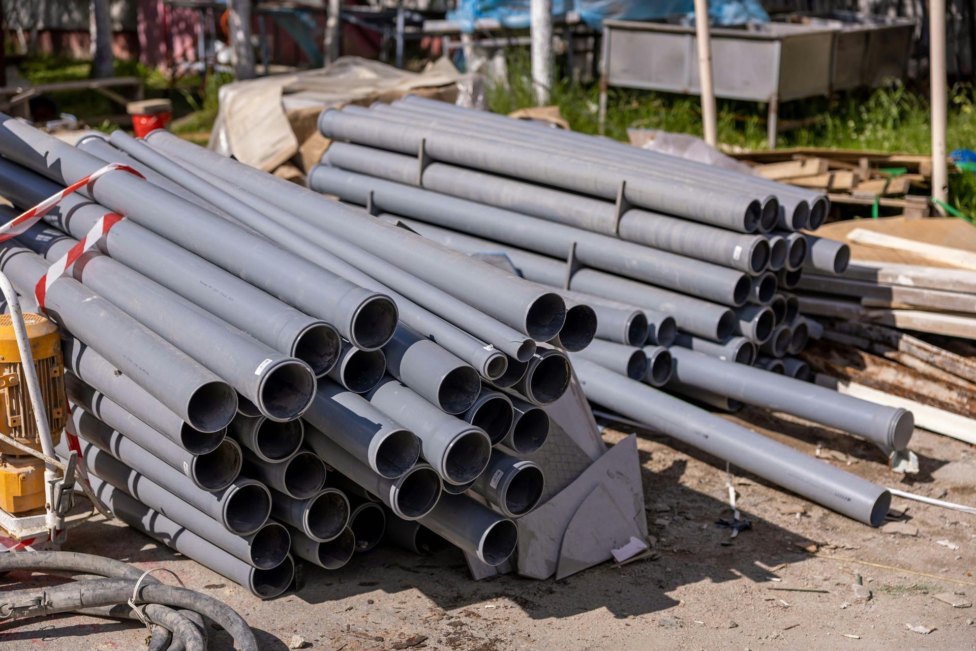 outdoor grey plumbing piping for a new construction business being built