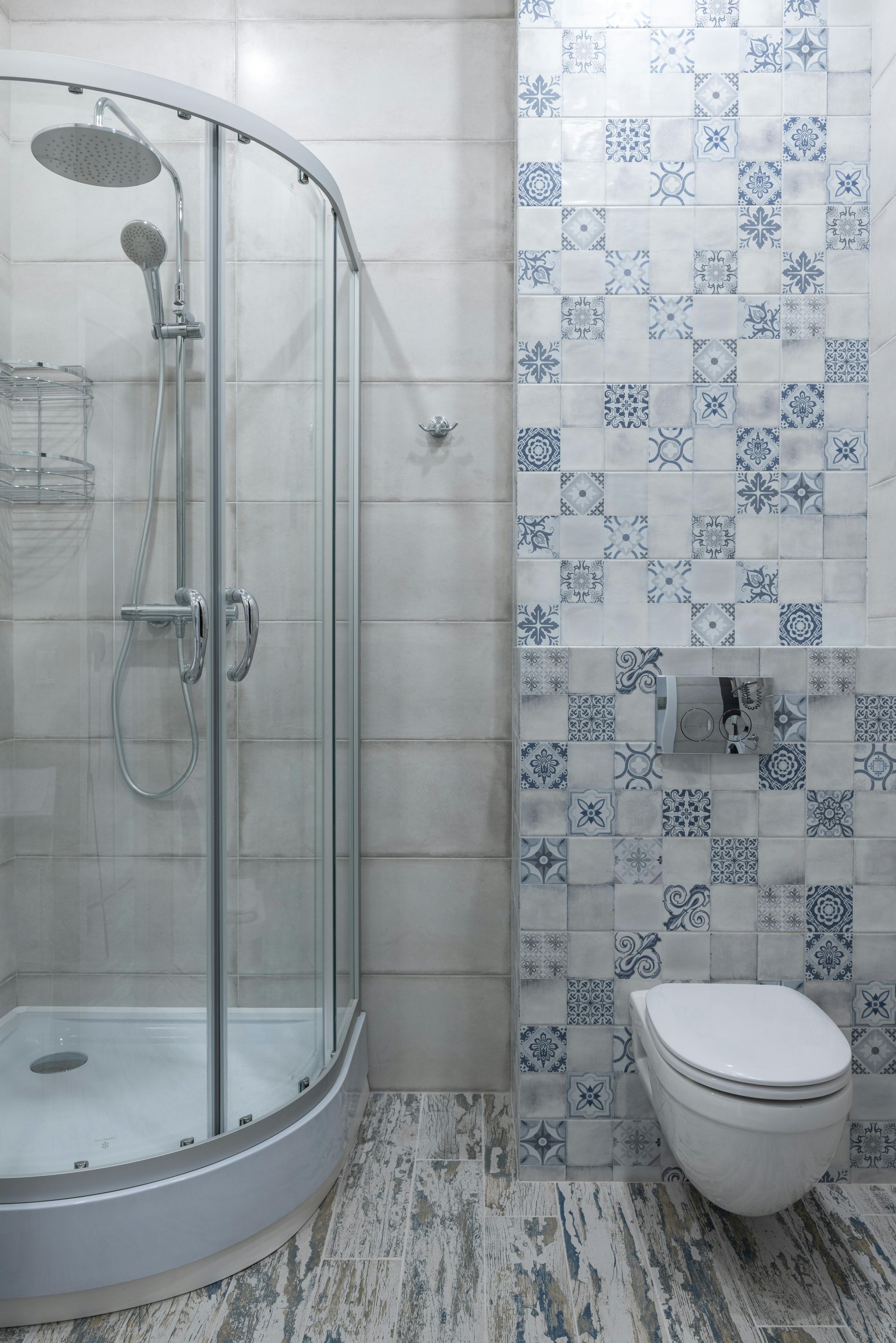 shower in a home in north georgia with blue and white tiled wall