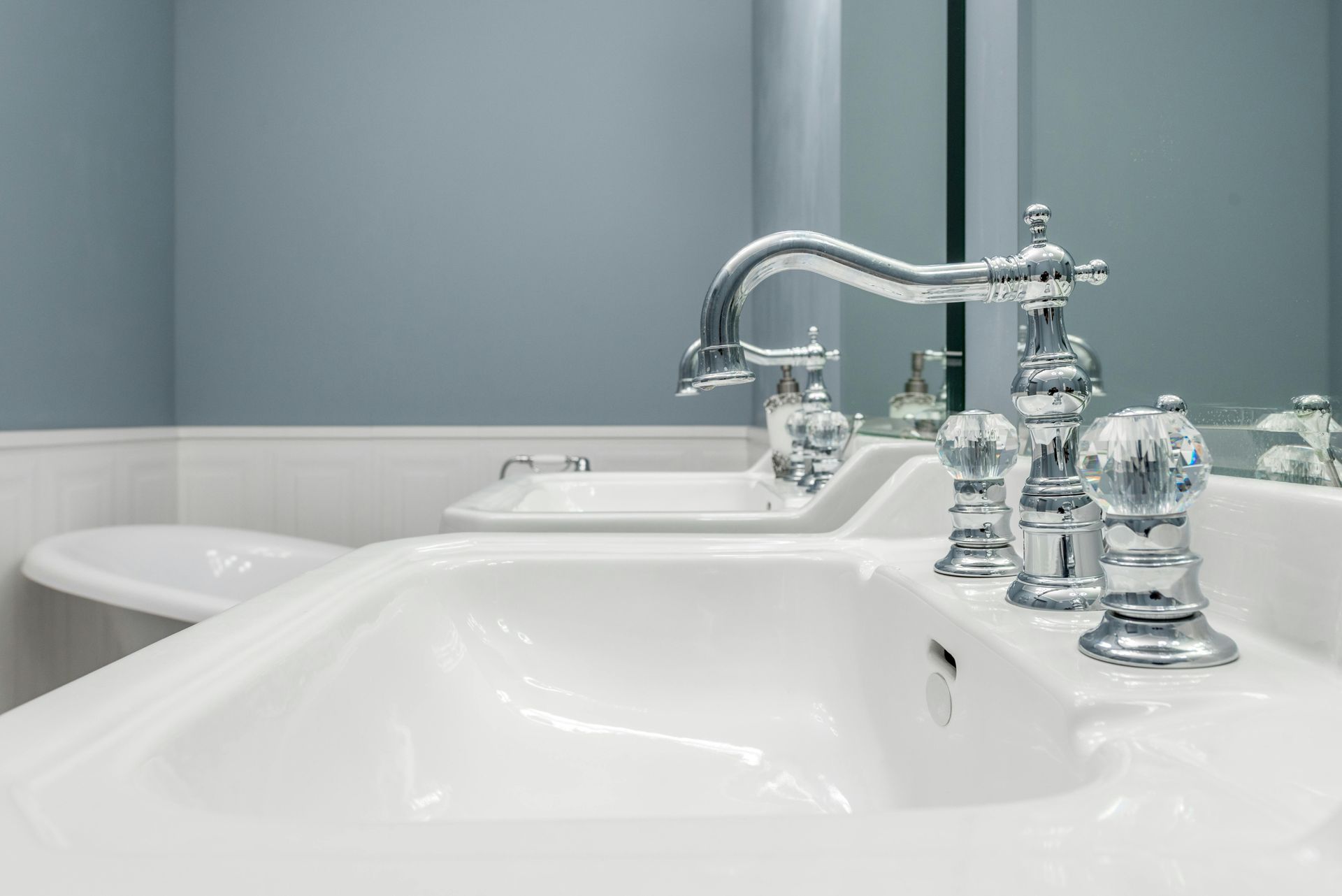 Plumbing services from Gainesville Plumbing with white sink and silver sink knobs and faucet