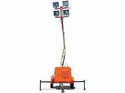 Orange mobile light tower with four lights on a telescopic mast, outdoors.