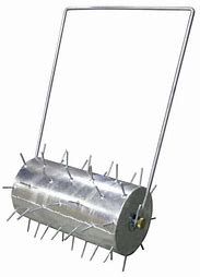 Spiked lawn roller with a silver metal cylinder and handle, used for aerating soil.