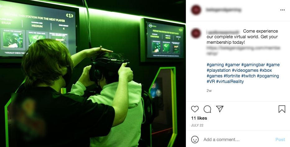 A woman is helping a man wear a virtual reality headset.