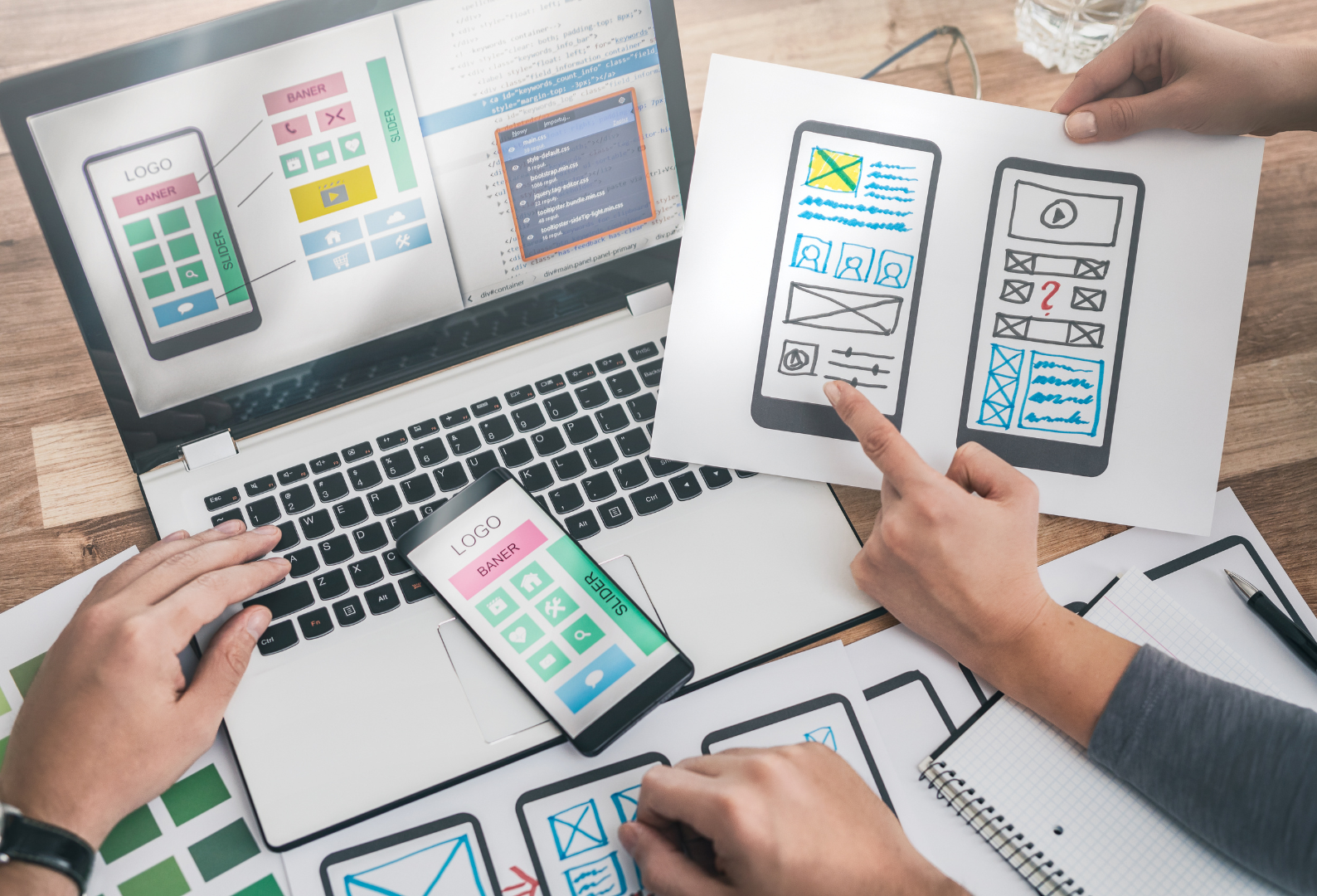 Designers drawing website ux app development.